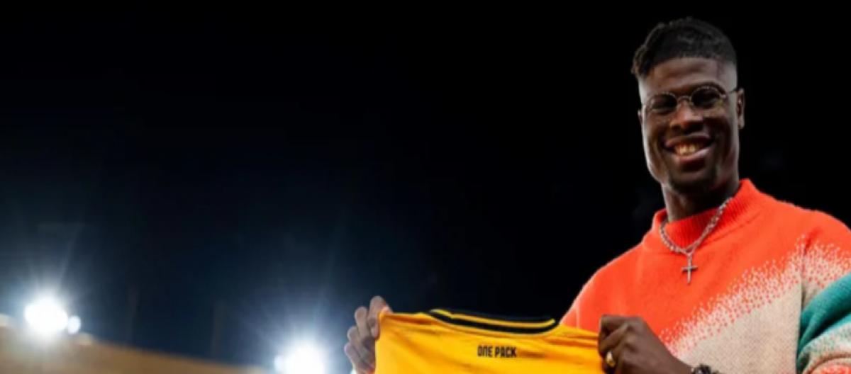 Reims centre-back Emmanuel Agbadu officially joins Wolves and will wear the No. 12 jersey