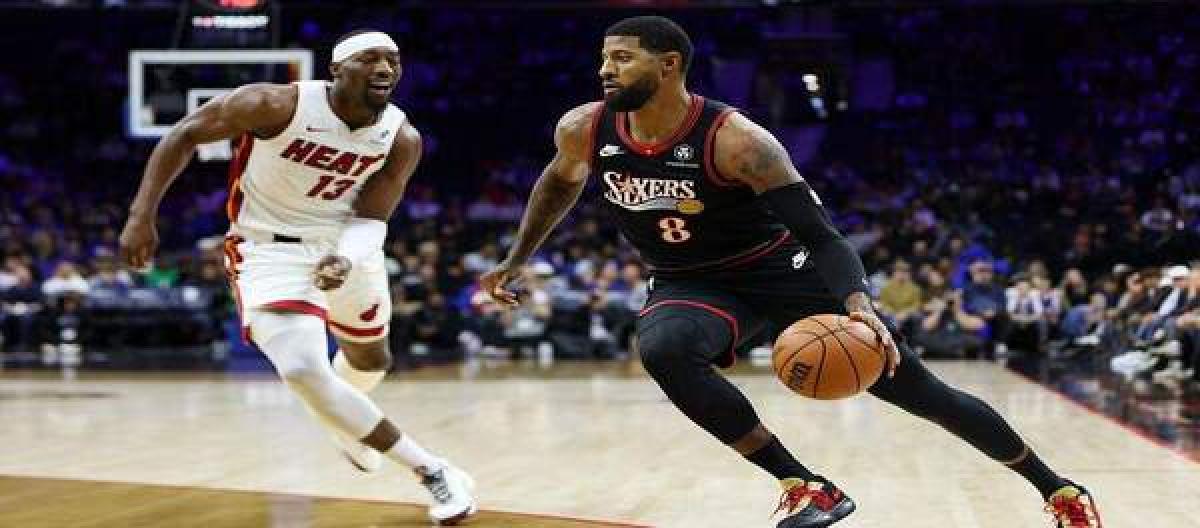 Powell scored 32 points, leading the Heat to a 127-115 victory over the 76ers.