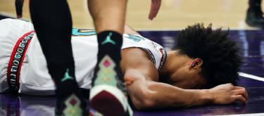 Jalen Wells was injured during the game and was carried off the court on a stretcher after falling.